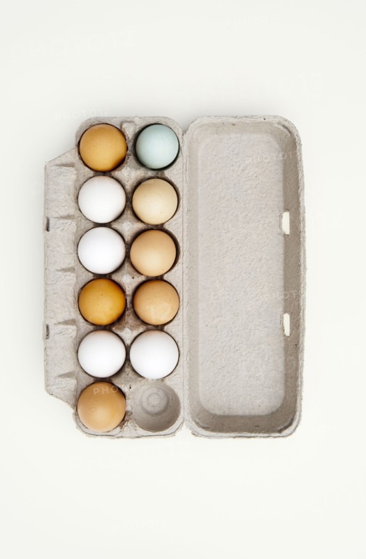 Colored eggs in egg carton