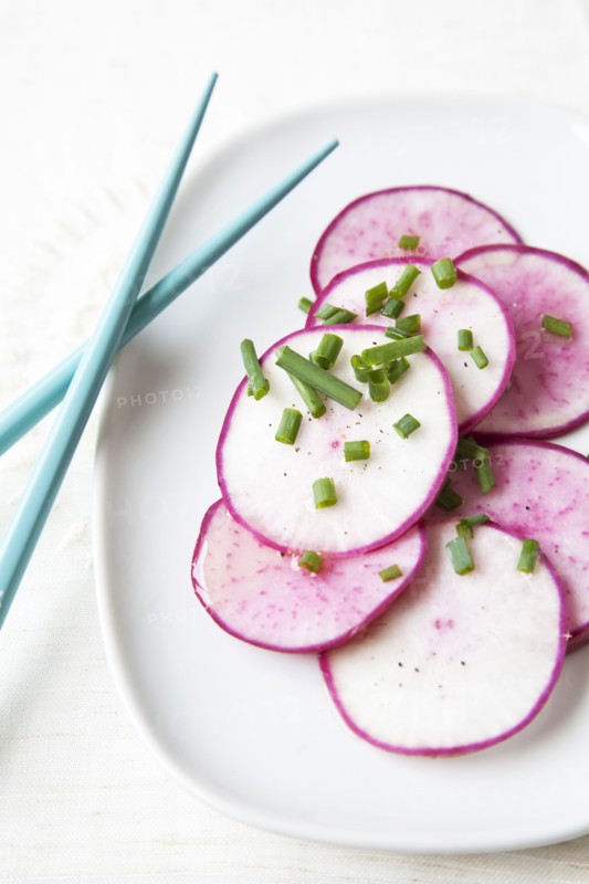 Sliced radishes on plate