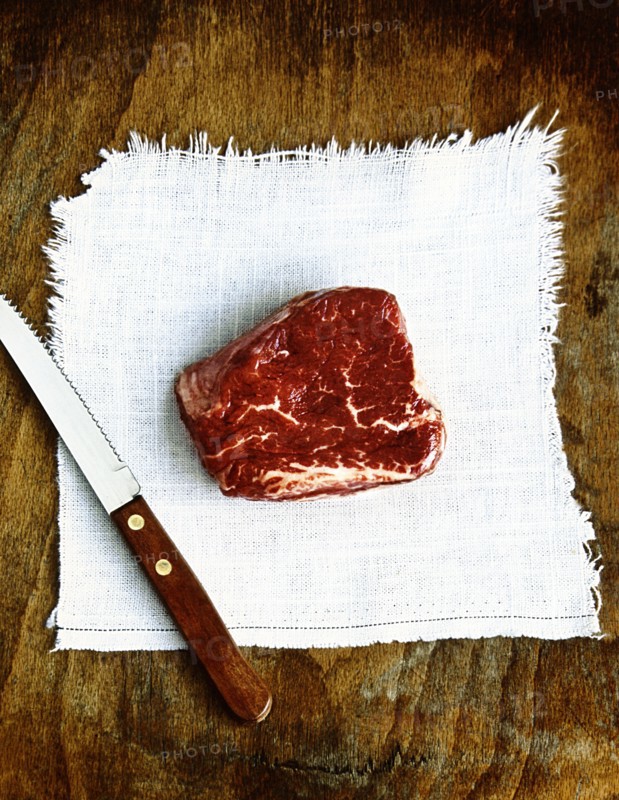 Raw beef and knife