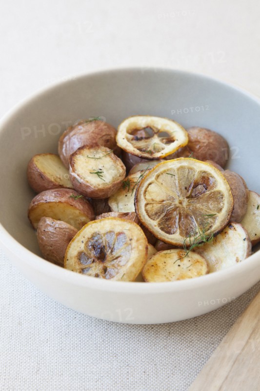 Potatoes and lemon in bowl