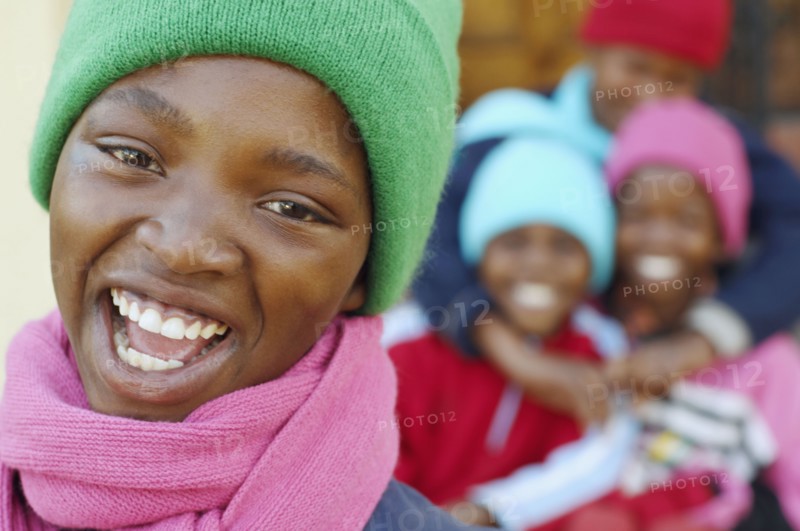 African girl with friends in background