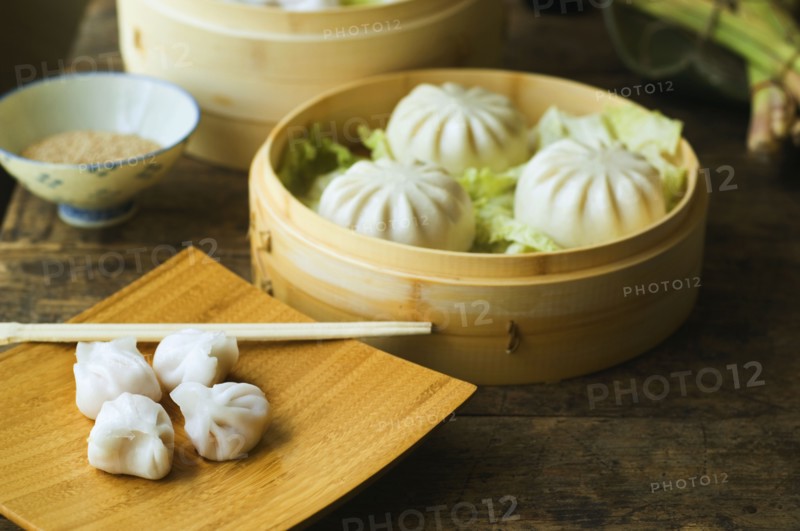 Asian dumpling in steamer with cabbage