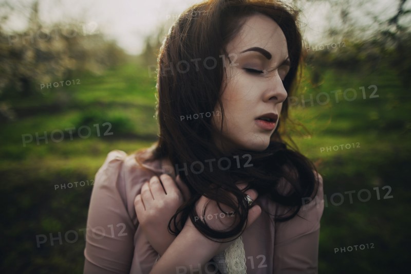Wind blowing hair of Caucasian woman