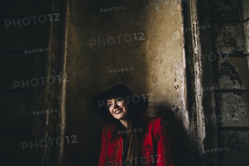 Portrait of smiling Caucasian woman leaning in alcove