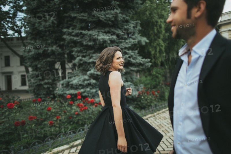 Smiling Caucasian woman looking at man