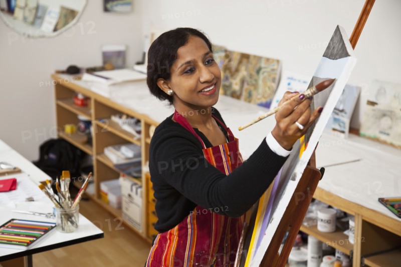 Indian woman painting
