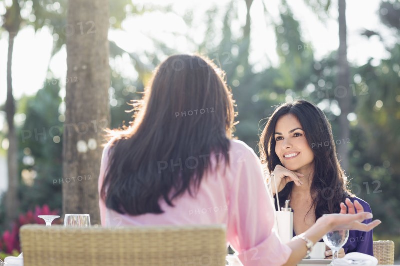 Hispanic friends having lunch together