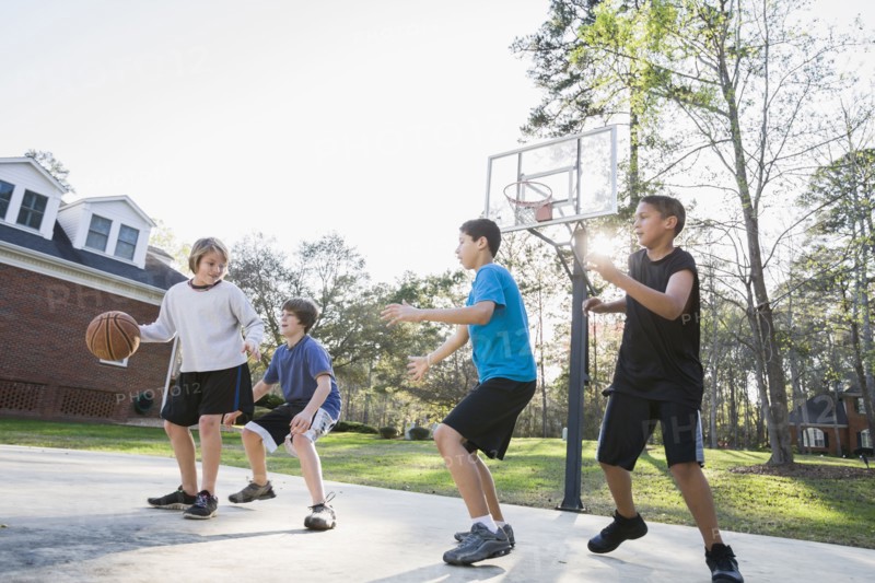 Boys playing basketball