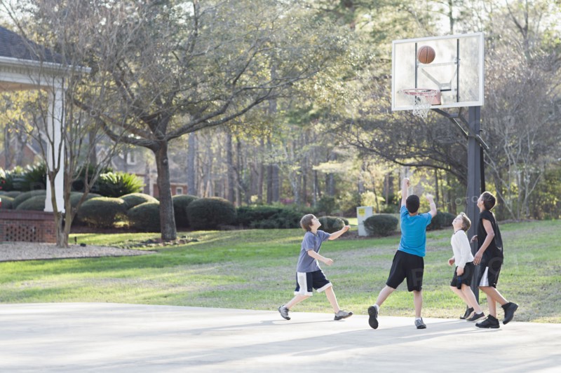 Boys playing basketball