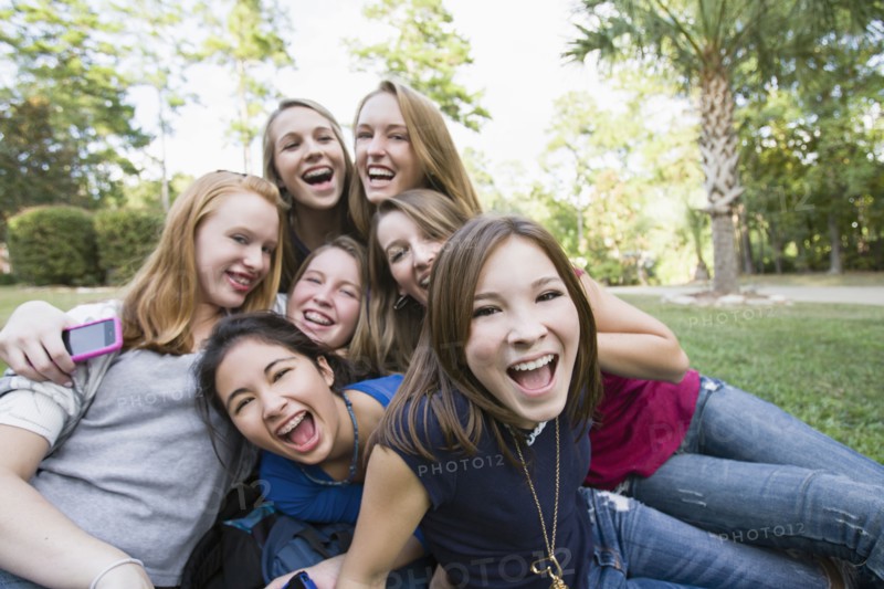 Friends hanging out together on grass