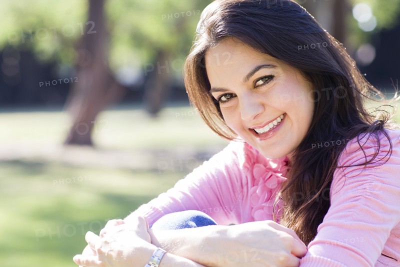 Hispanic woman smiling outdoors