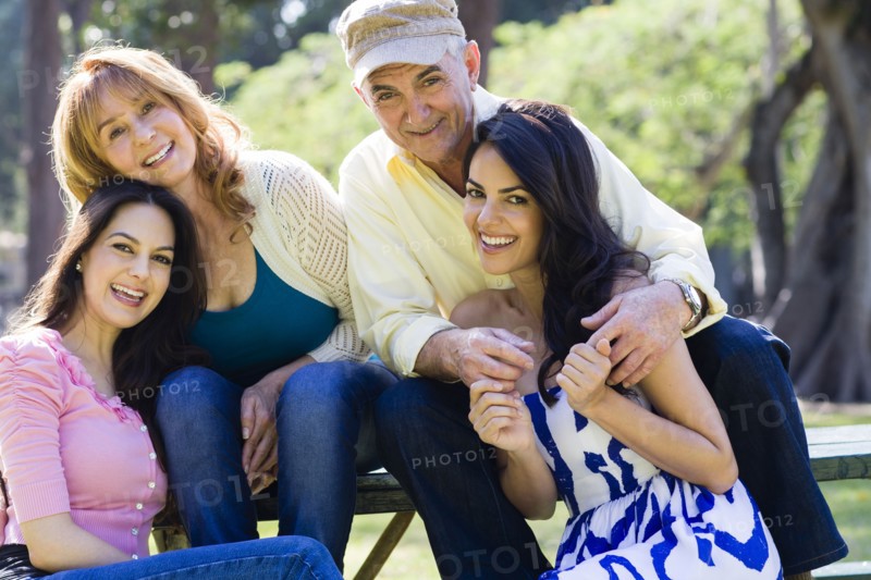 Hispanic family smiling outdoors