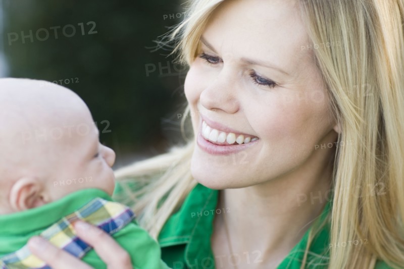 Caucasian mother holding baby