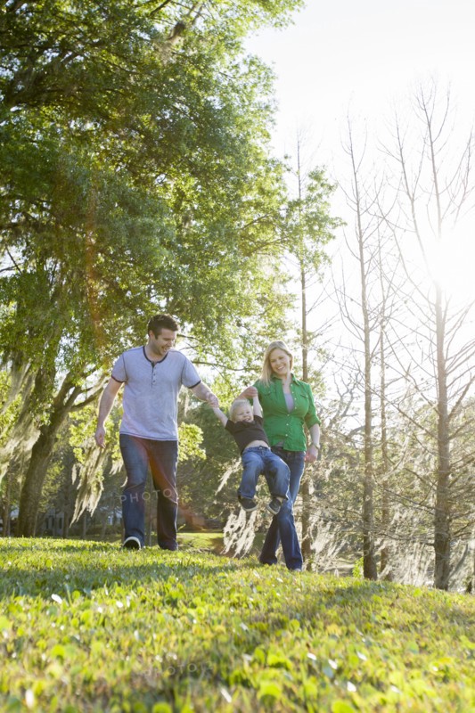 Caucasian family walking in park