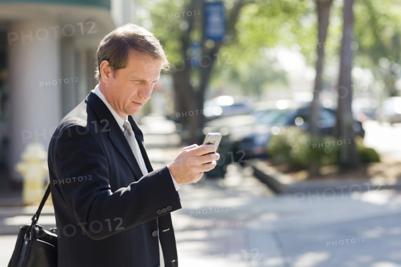 Caucasian businessman using cell phone