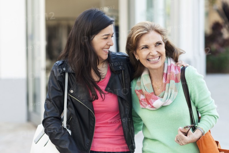 Mother and daughter walking outdoors