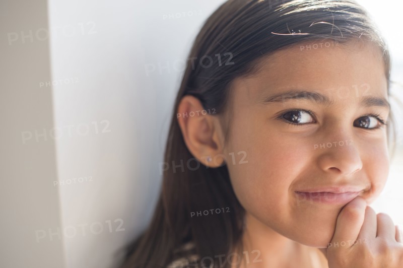 Close up of smiling girl indoors