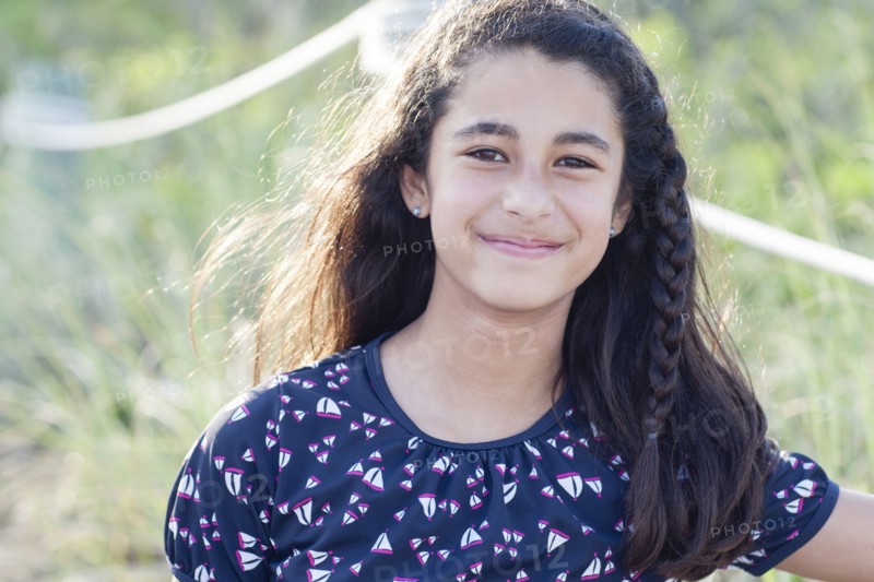Mixed race girl smiling outdoors