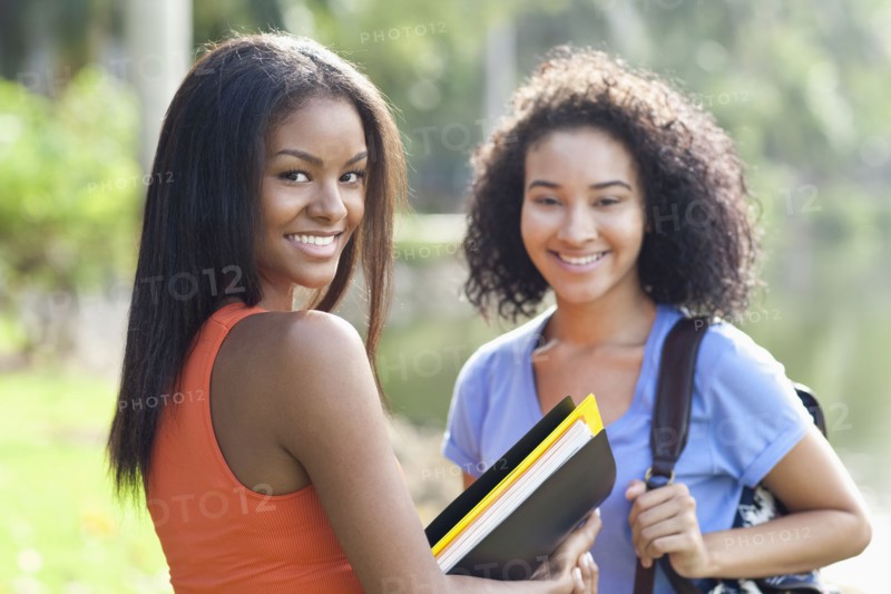 Black students smiling outdoors