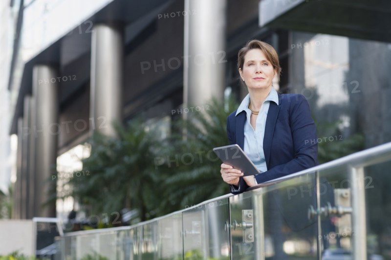 Caucasian businesswoman using digital tablet outdoors