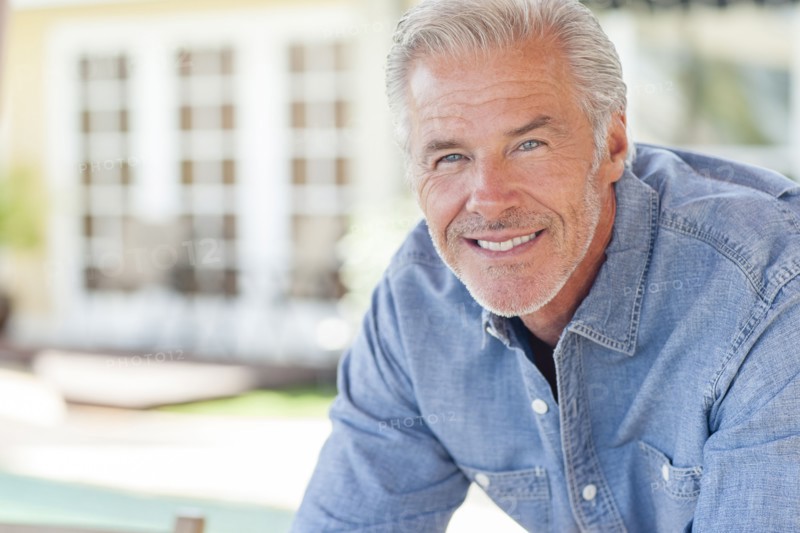 Caucasian man leaning on counter
