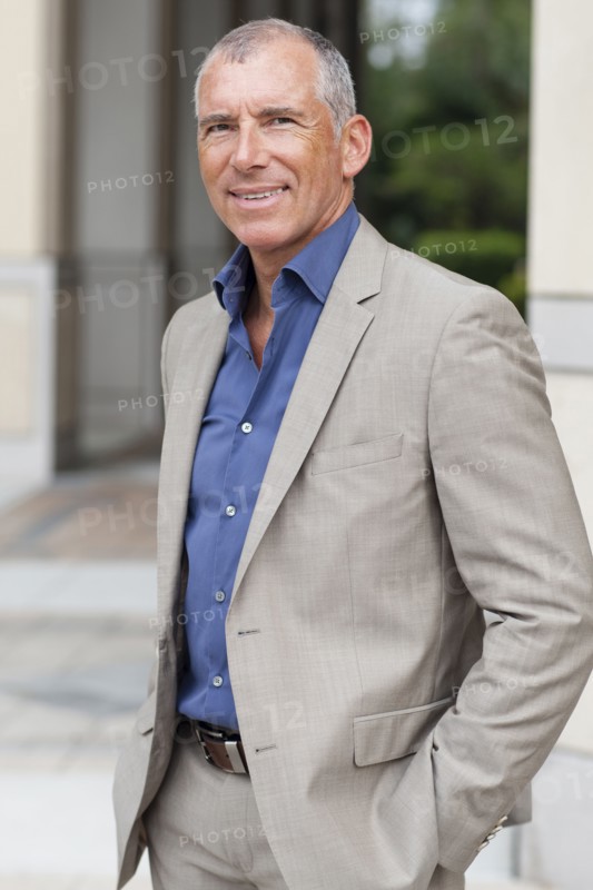 Caucasian businessman smiling in city