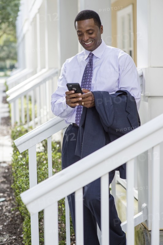 Black businessman using cell phone