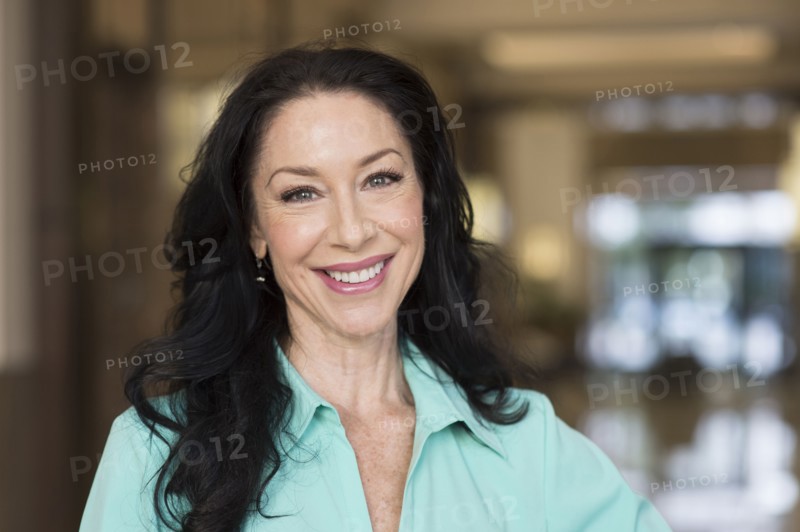 Caucasian woman smiling indoors