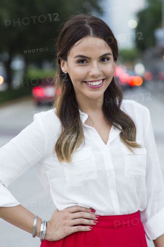 Hispanic businesswoman smiling outdoors