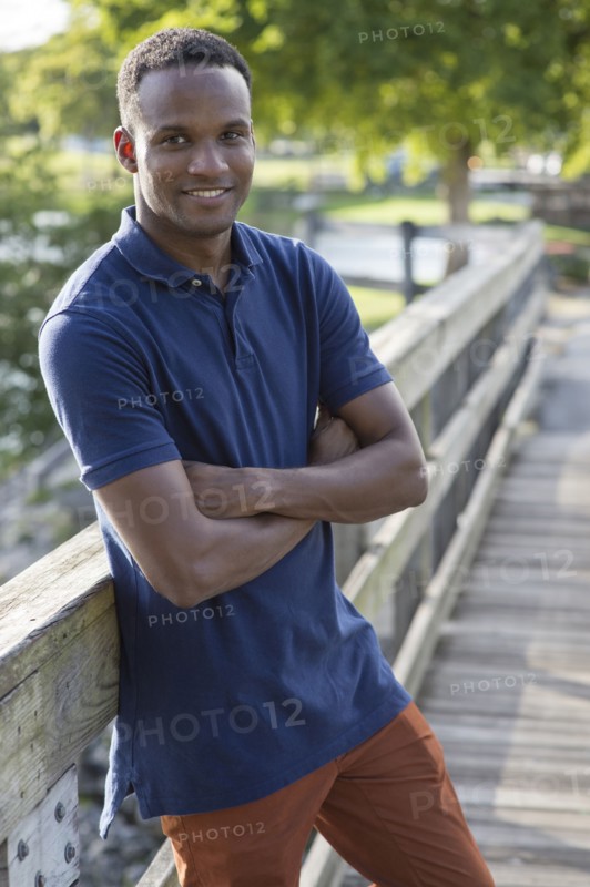 Black man smiling outdoors