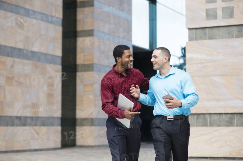 Businessmen talking outdoors