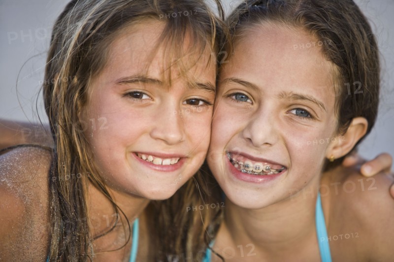 Close up of smiling Hispanic girls