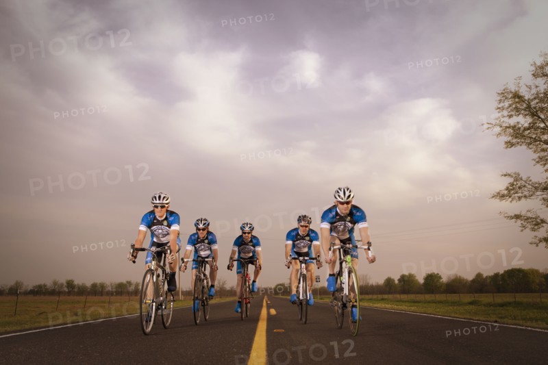 Competitive bicyclists racing on remote rode