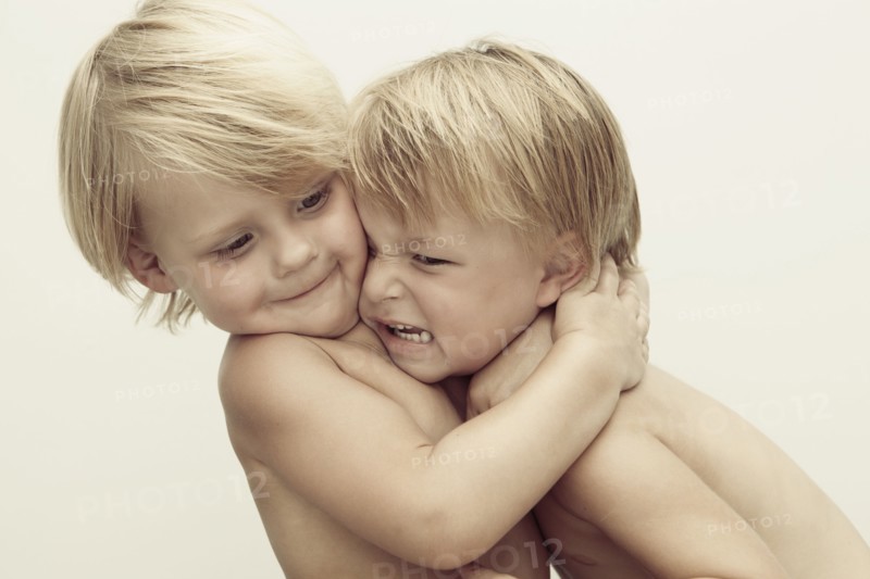 Caucasian boys wrestling