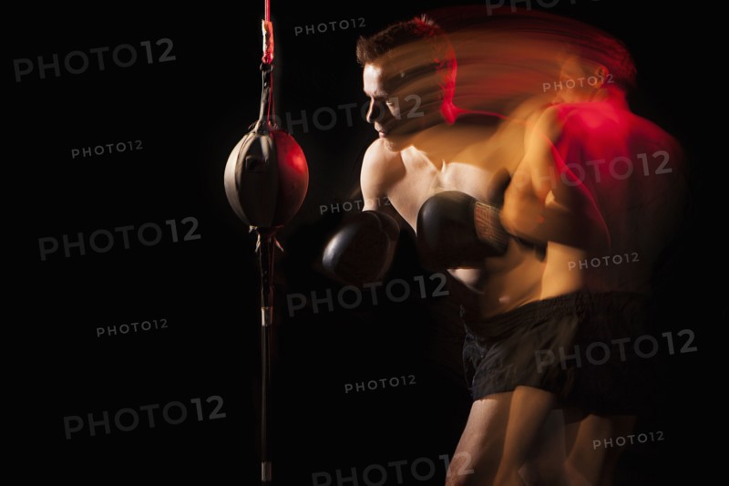 Blurred view of Caucasian boxer training