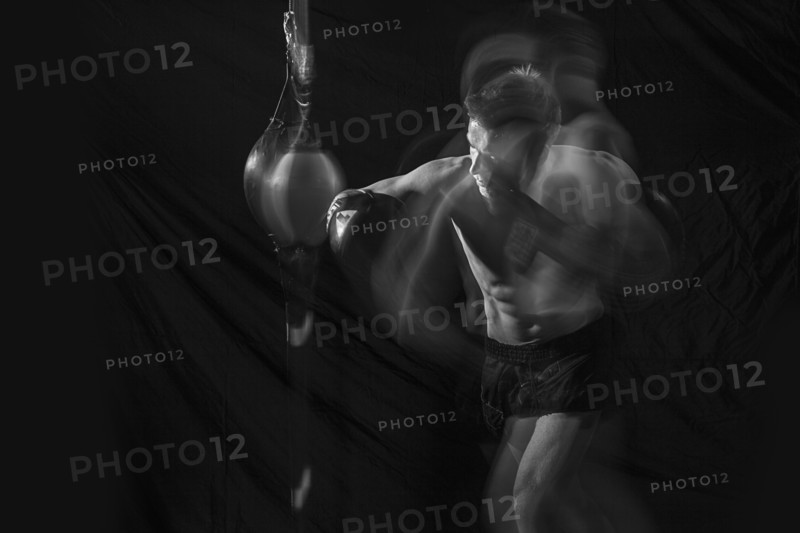 Blurred view of Caucasian boxer training