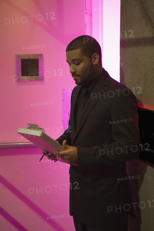 African American bouncer working at nightclub
