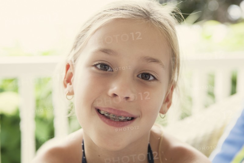 Caucasian girl smiling with braces
