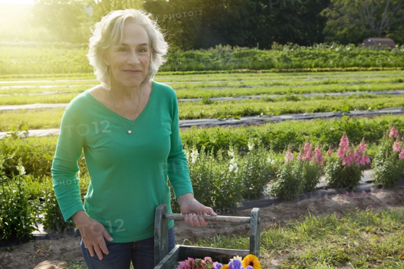 Older Caucasian woman smiling on farm