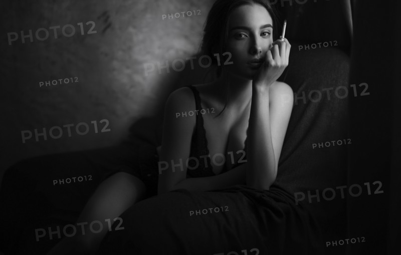 Caucasian woman smoking cigarette