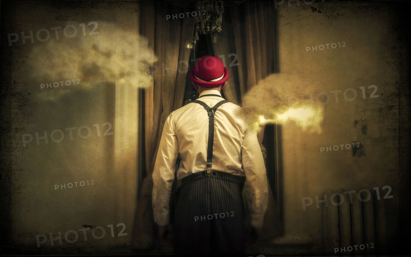 Caucasian man peering through window