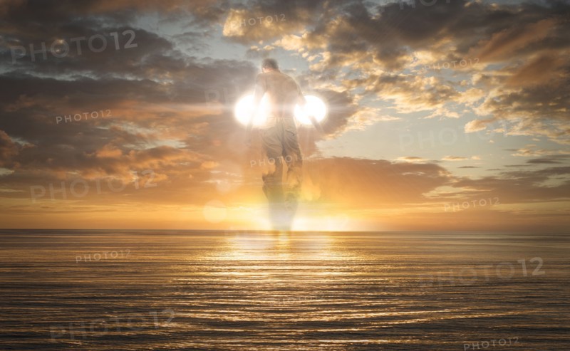 Caucasian man flying over ocean horizon