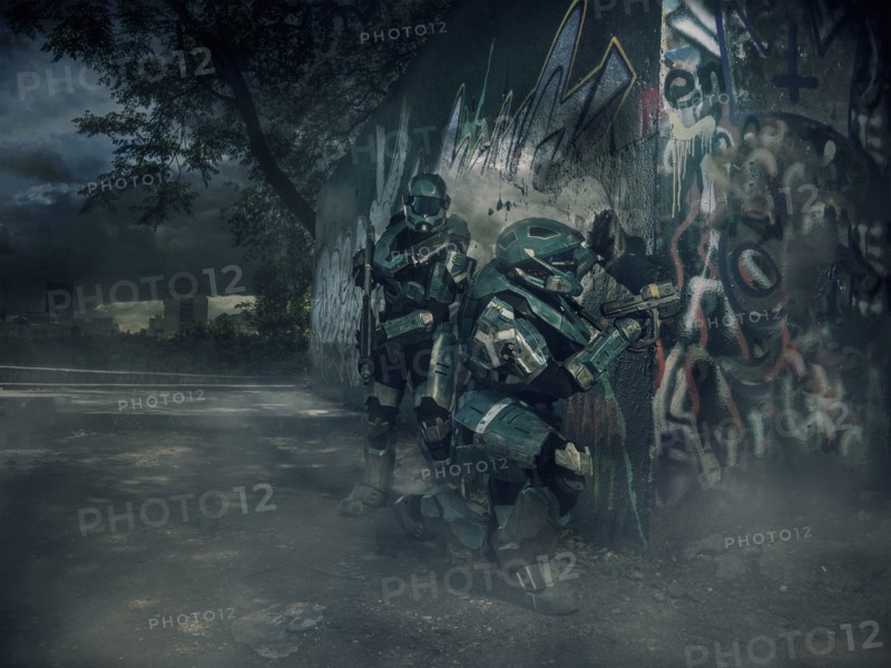 Robots patrolling city holding rifle