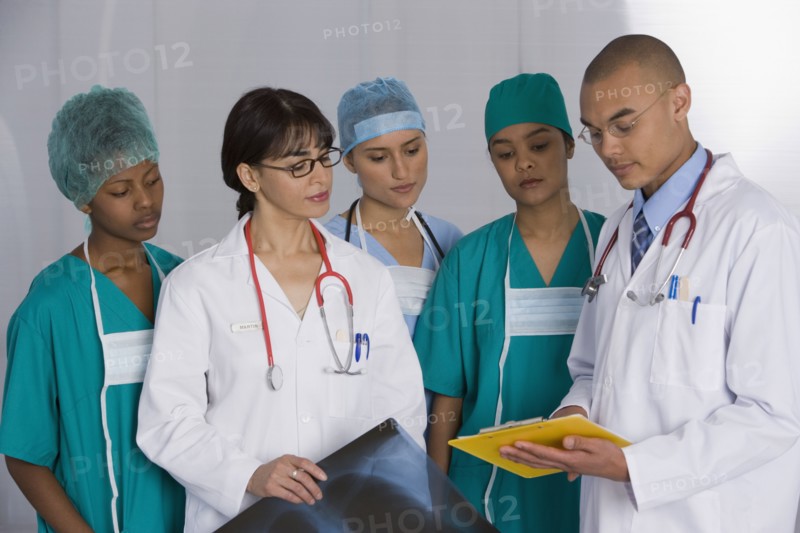 Multi-ethnic doctors discussing chart