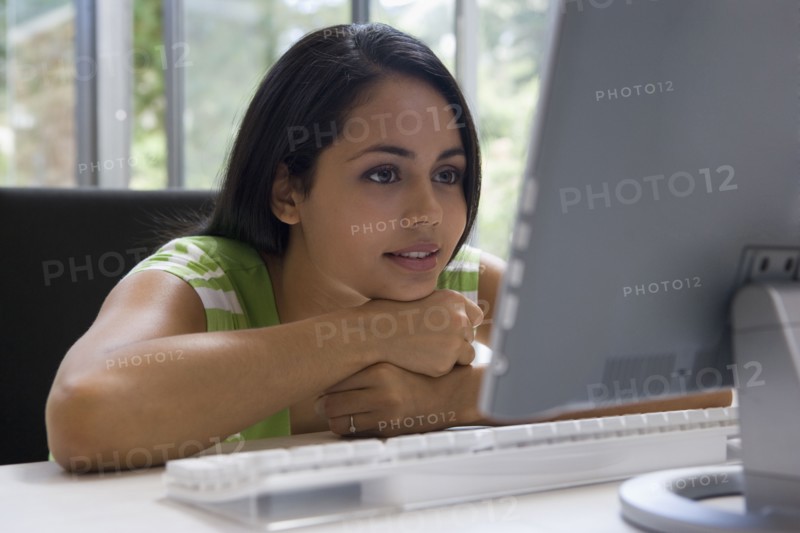 Young woman looking at computer