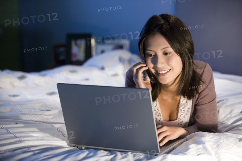 Asian woman talking on cell phone