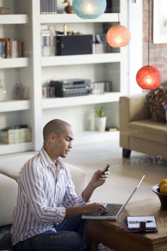 African American man looking at cell phone