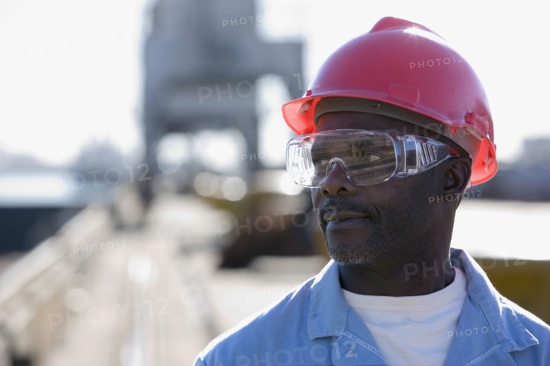 African American male construction worker wearing hardhat