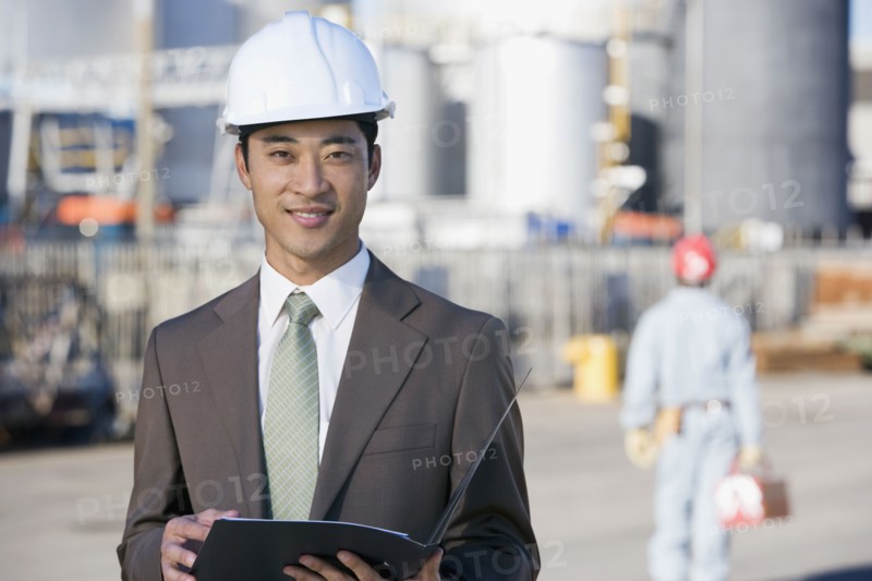 Asian businessman wearing hardhat