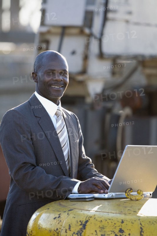 African American businessman typing on laptop